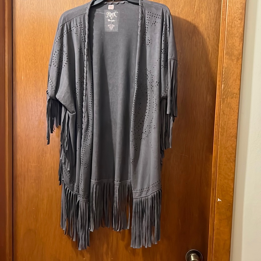 Western style gray cardigan with fringe on bottom and front edges and sleeves.